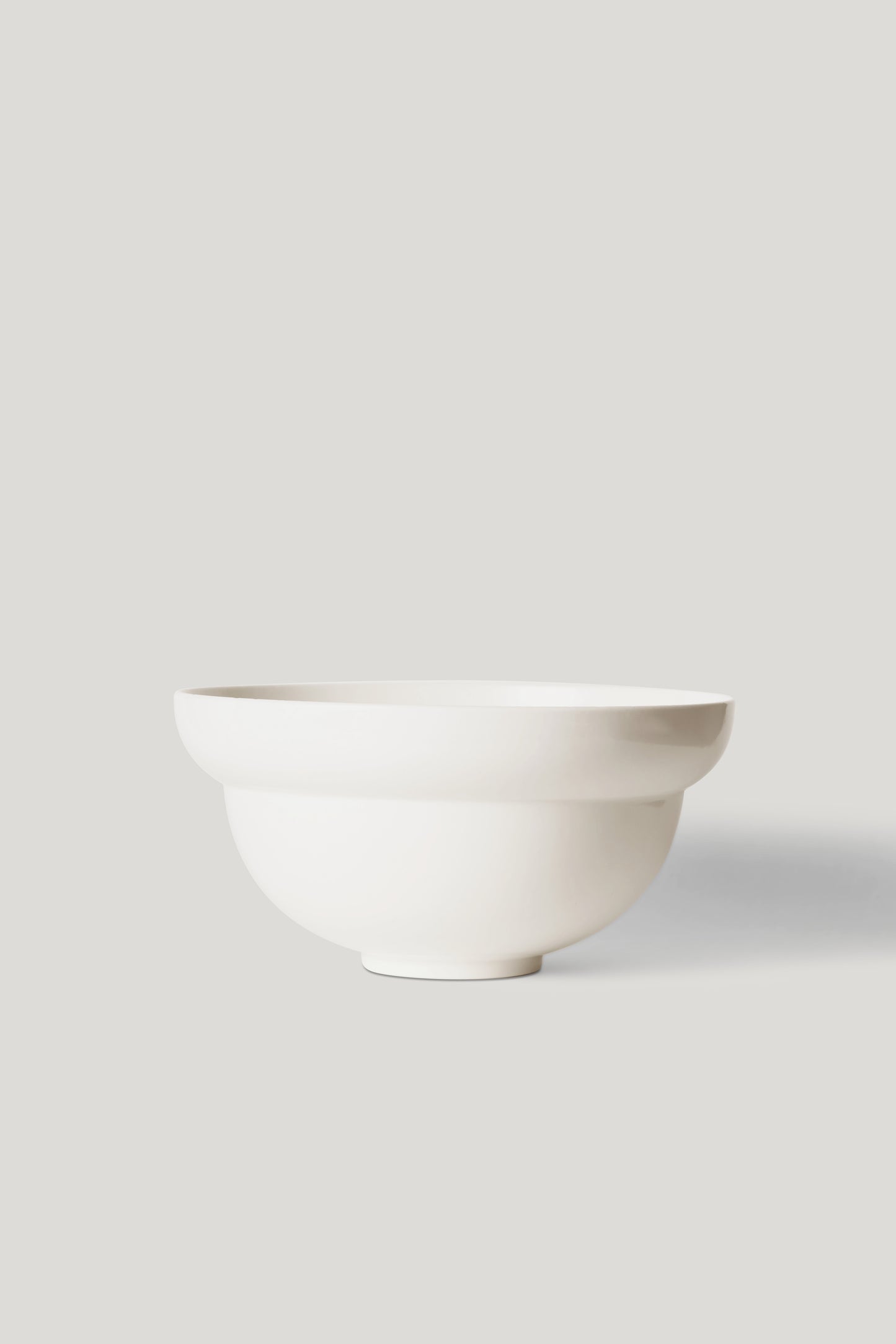 White ceramic bowl on a light gray background