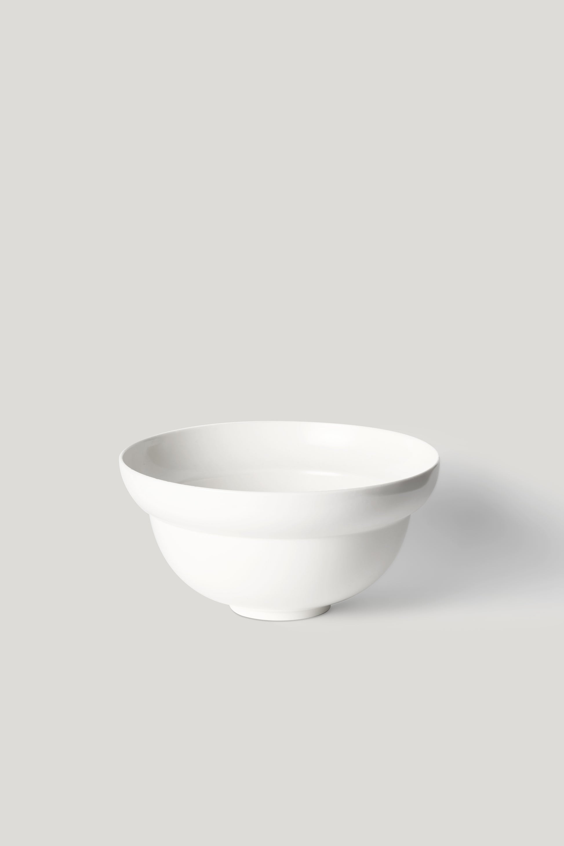 White ceramic bowl on a light gray background