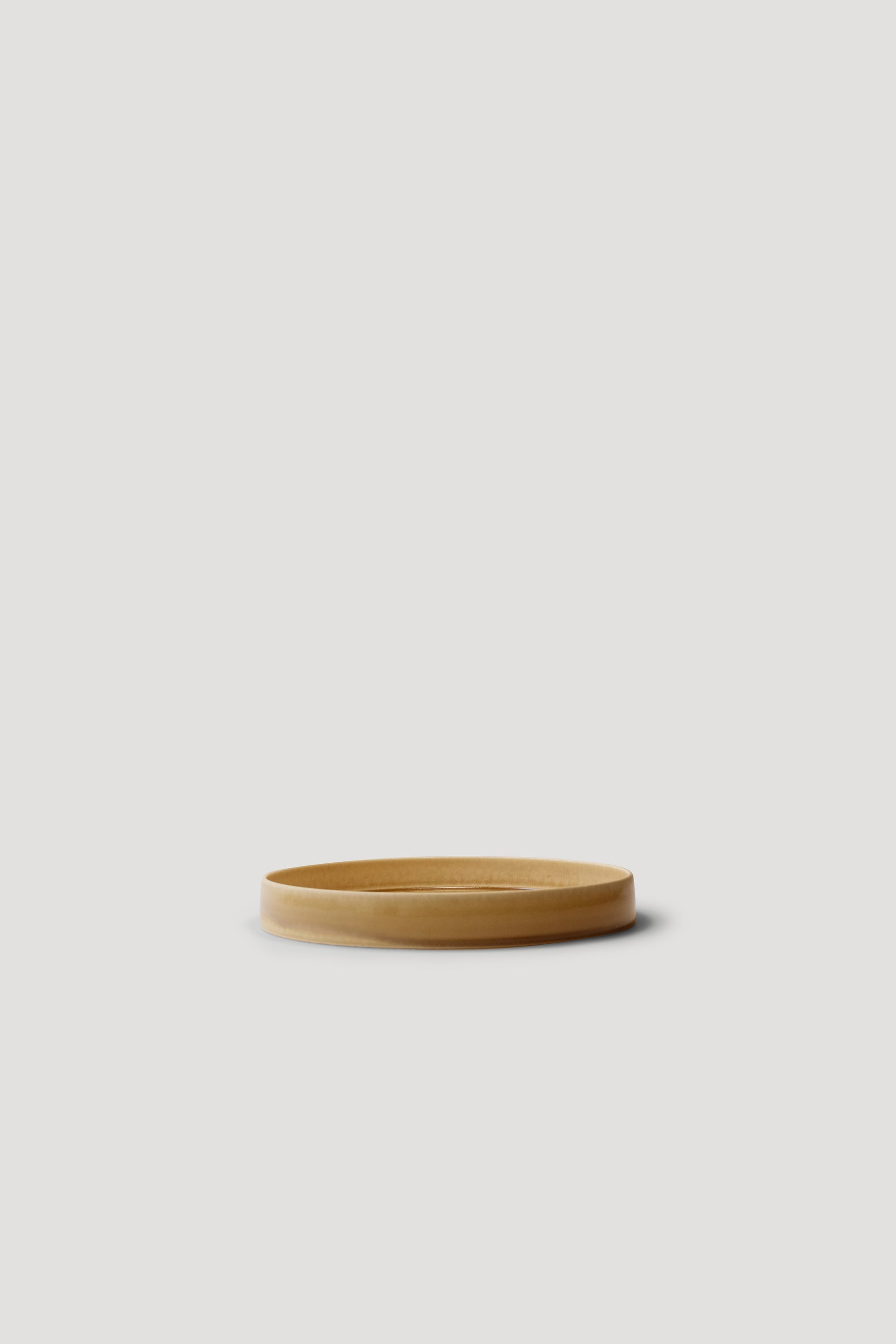 Wooden bowl on a light gray background