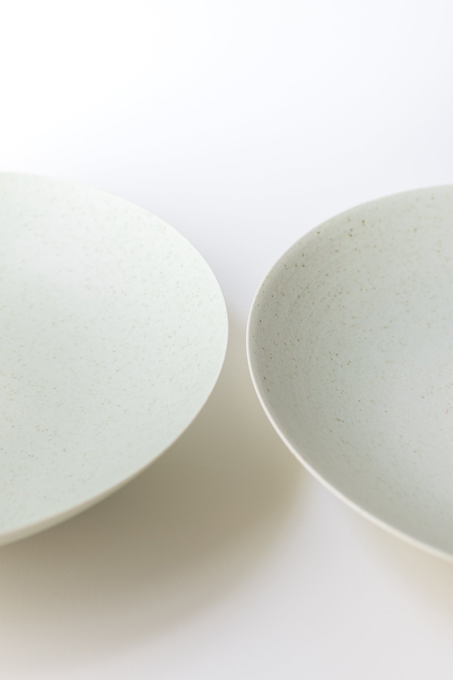 Two ceramic bowls on a white background