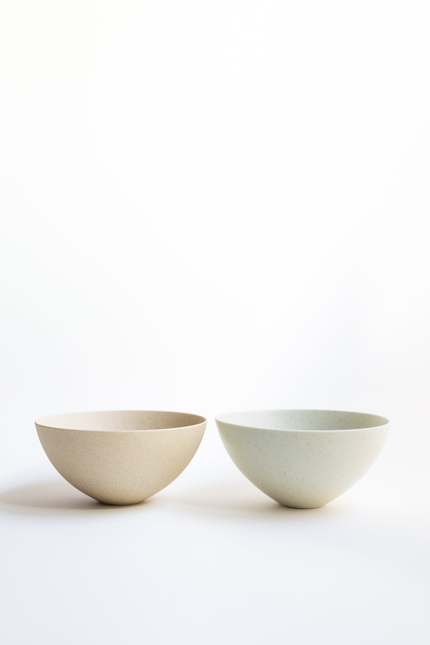 Two ceramic bowls on a white background