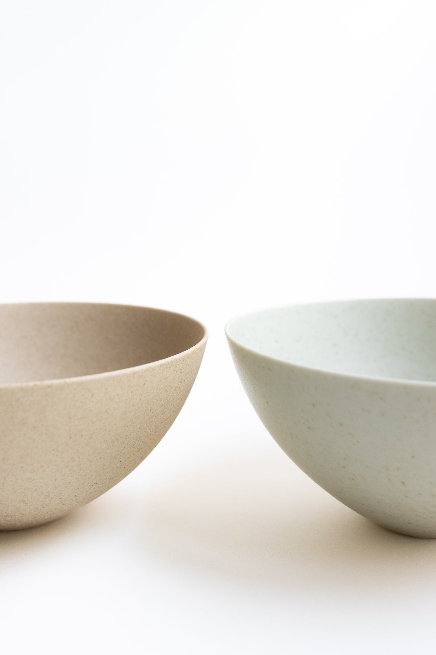 Two ceramic bowls on a white background