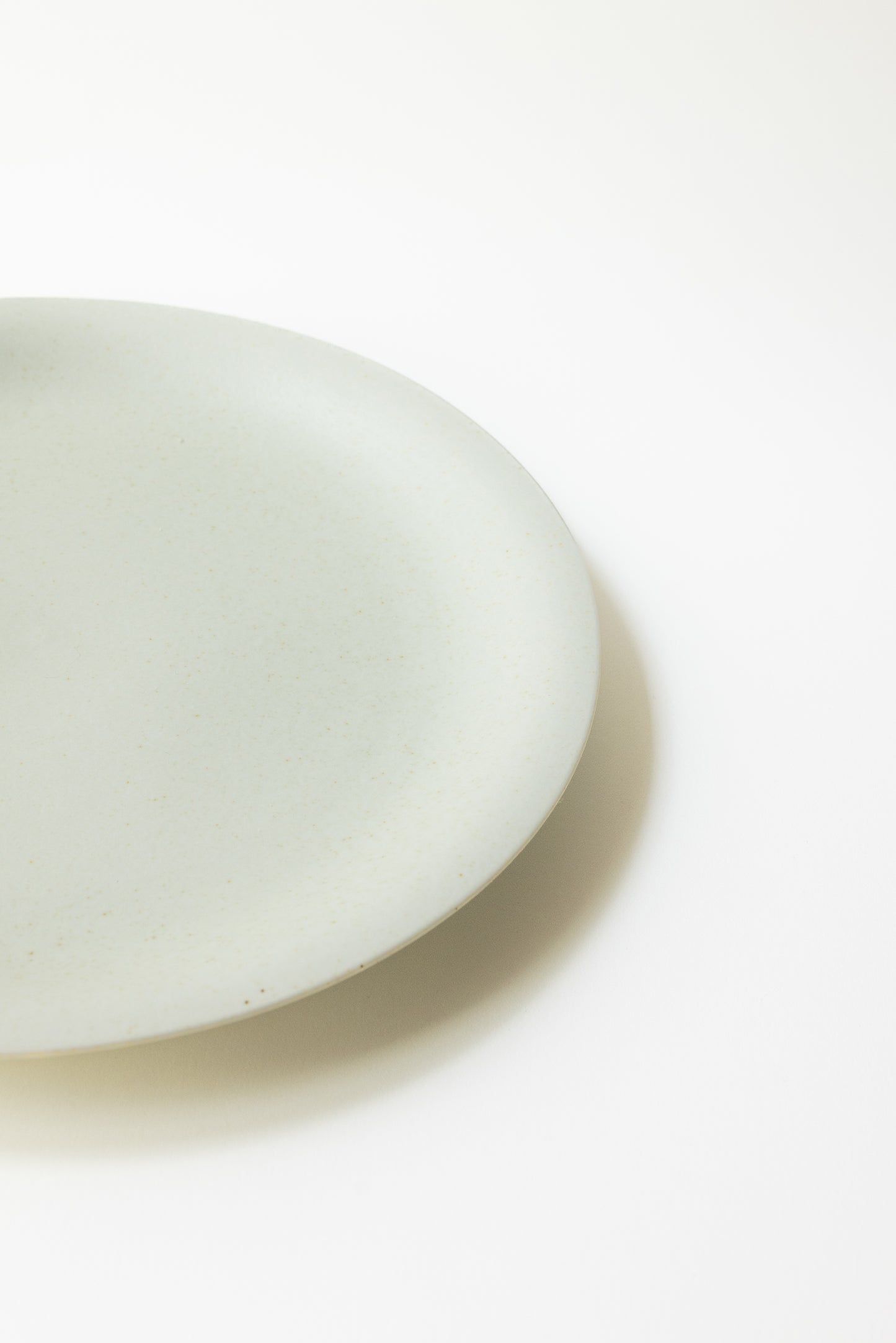 White ceramic plate on a white background