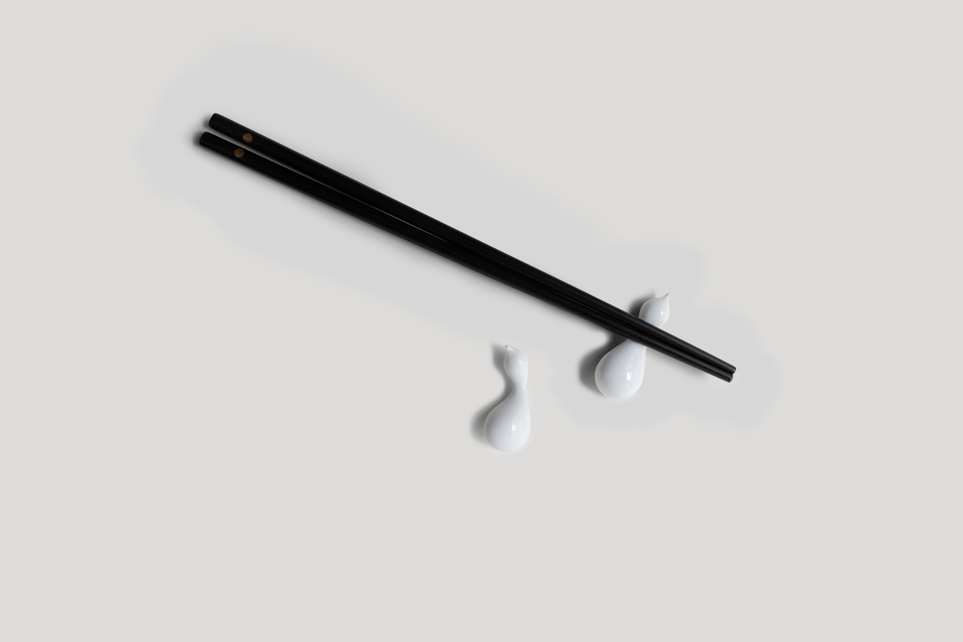 Black chopstick on a white background